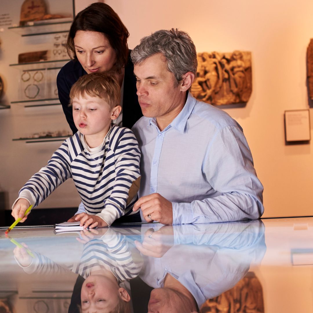 child and parents at museum 