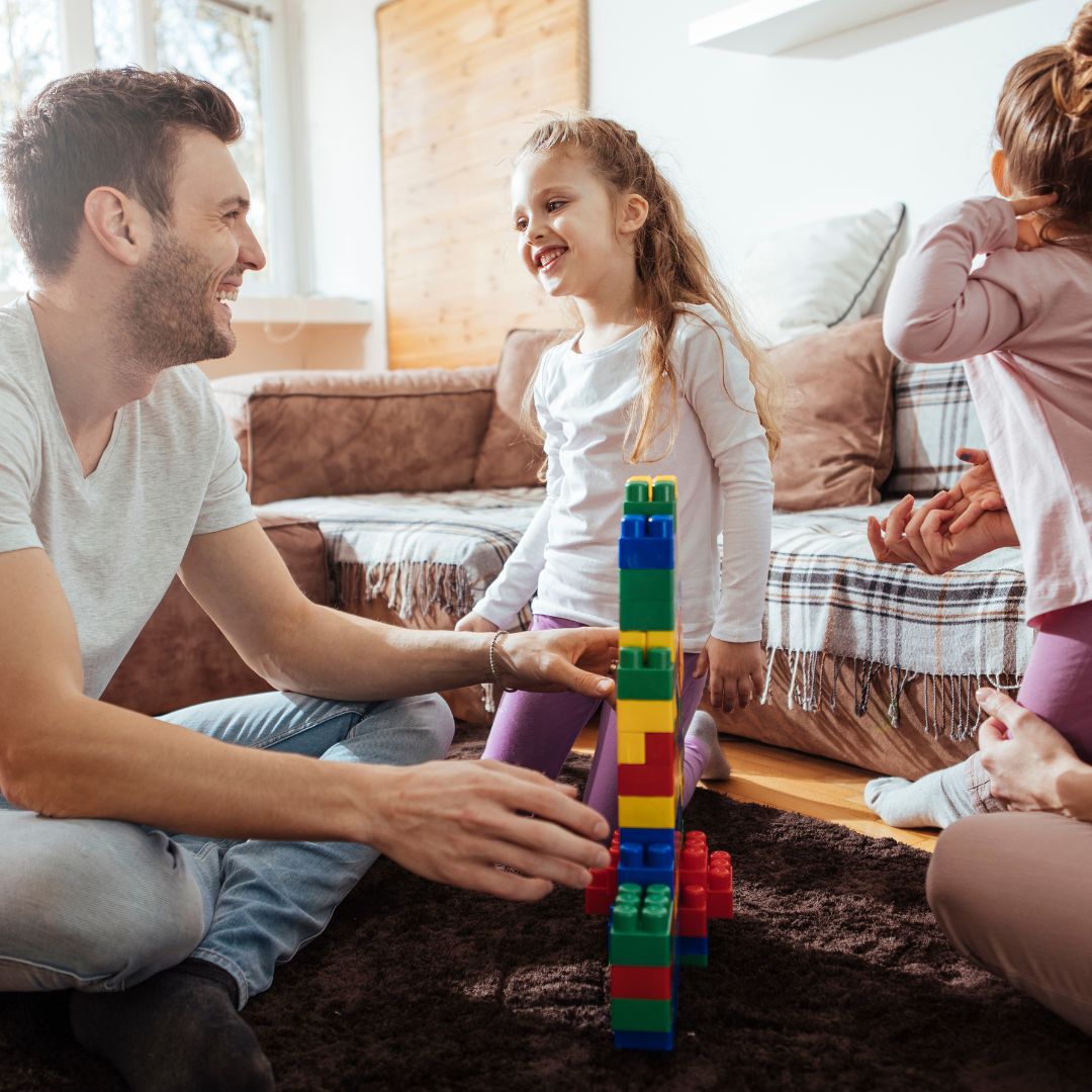 family playing with blocks